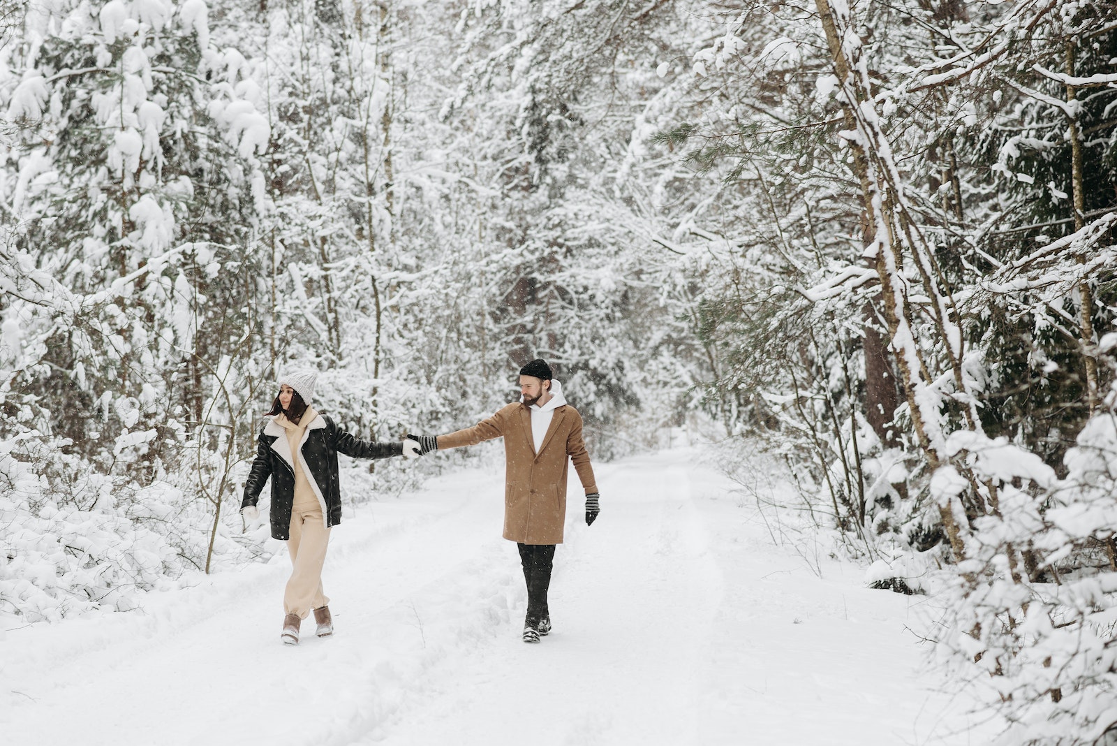 Couple Walking on Snow Covered Ground