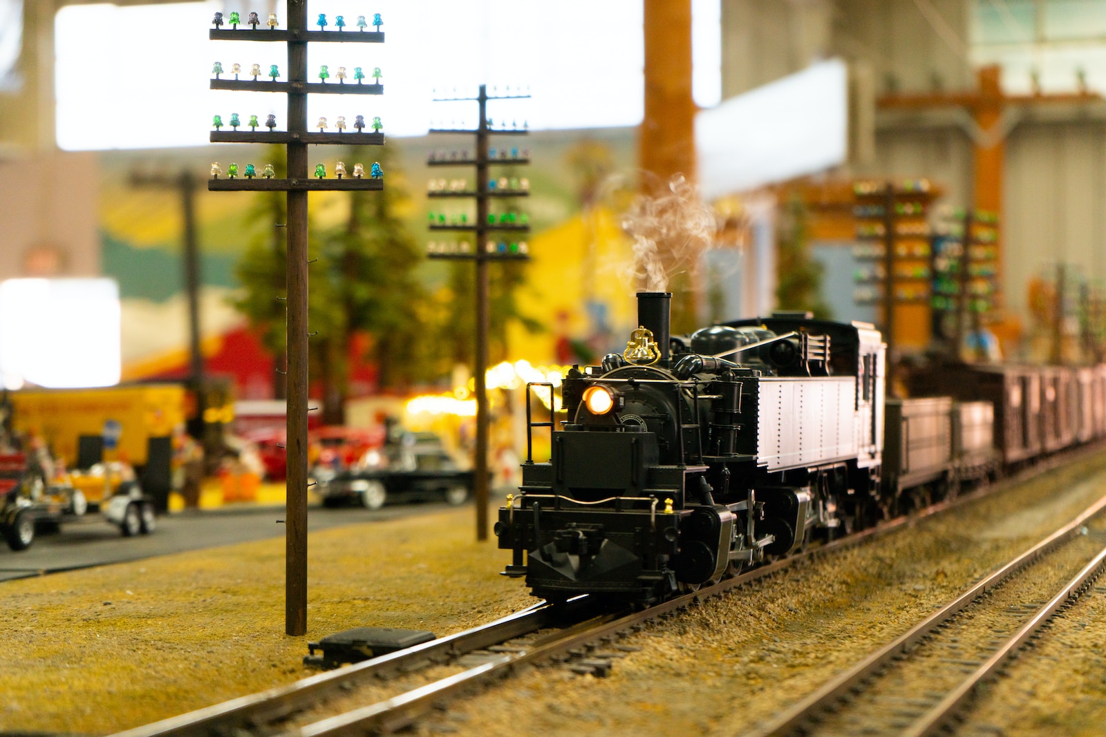 a toy train is on the tracks in a toy town